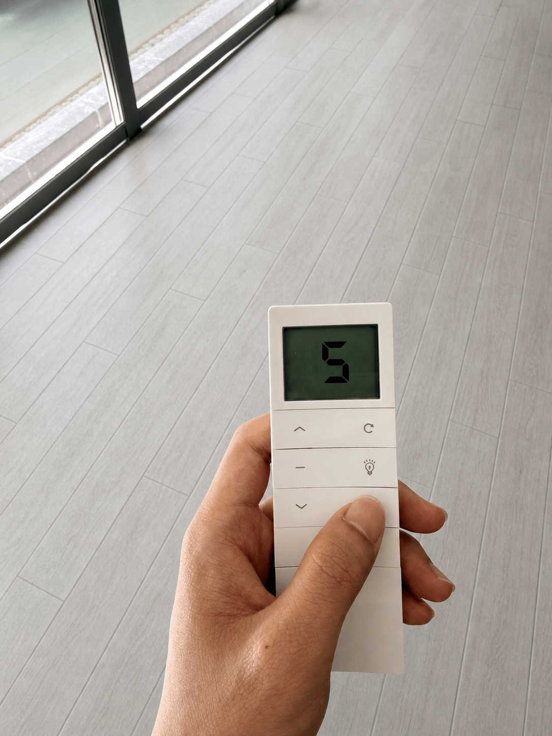 Multi-channel remote control for motorised balcony blinds