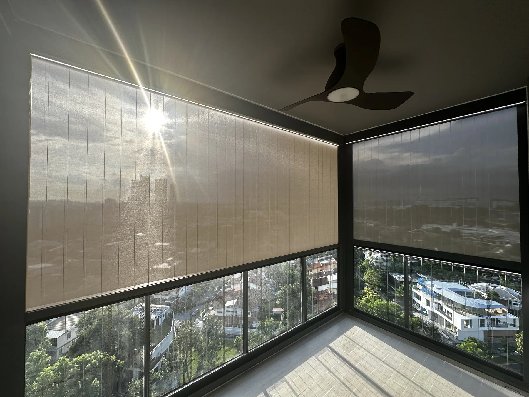 Outdoor blinds installed on a high-floor condo balcony in Singapore